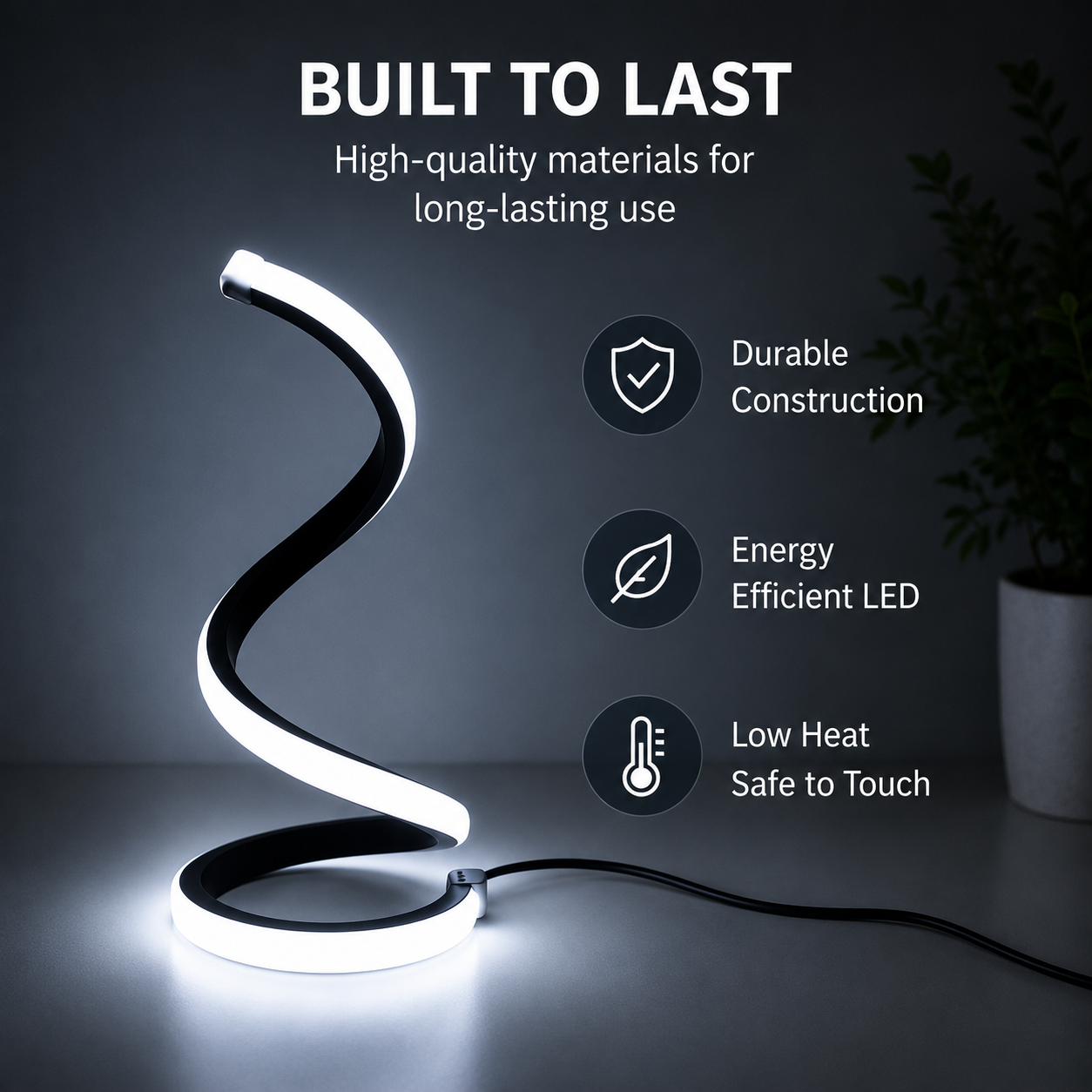 A modern spiral-shaped LED desk lamp glowing white, shown on a dark gray surface with promotional text and icons highlighting durability, energy efficiency, and low heat. A small potted plant is visible in the background on the right.