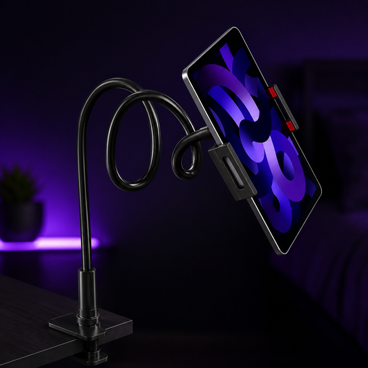 A black flexible desk phone stand with a smartphone mounted in a black clip, shown in a dimly lit room with purple ambient lighting in the background.