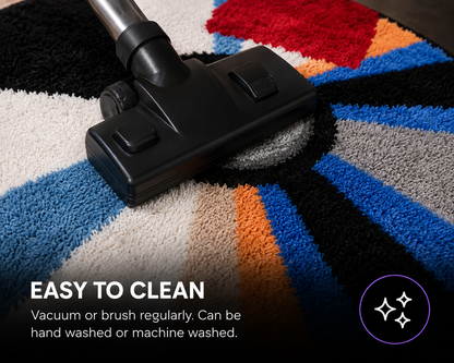 A close-up of a black vacuum head cleaning a colorful high-pile rug with text reading 'EASY TO CLEAN' and a small sparkle icon in the corner.