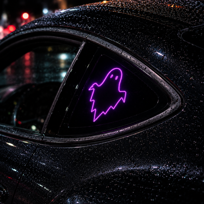 A purple neon ghost-shaped window sign displayed on the rear triangle window of a wet black car at night.