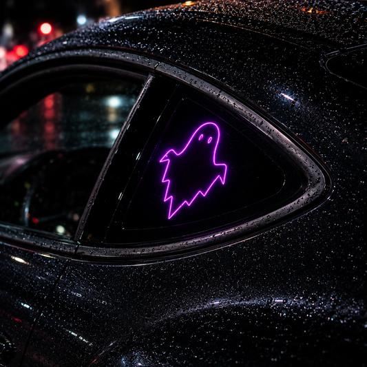 A purple neon ghost-shaped window sign displayed on the rear triangle window of a wet black car at night.