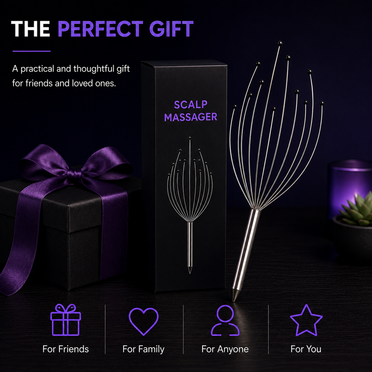 A scalp massager shown with its black retail box and a purple gift box with a ribbon on a dark background. The product itself is metallic silver with thin wire loops.