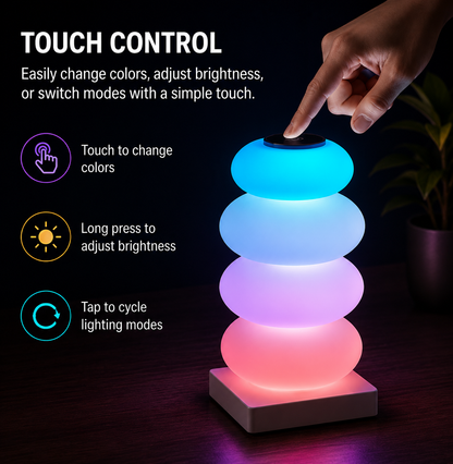 A glowing stackable LED lamp with four rounded tiers on a square base, shown on a dark tabletop with a hand touching the top button. Text on the left explains touch control, color changing, brightness adjustment, and lighting mode cycling.